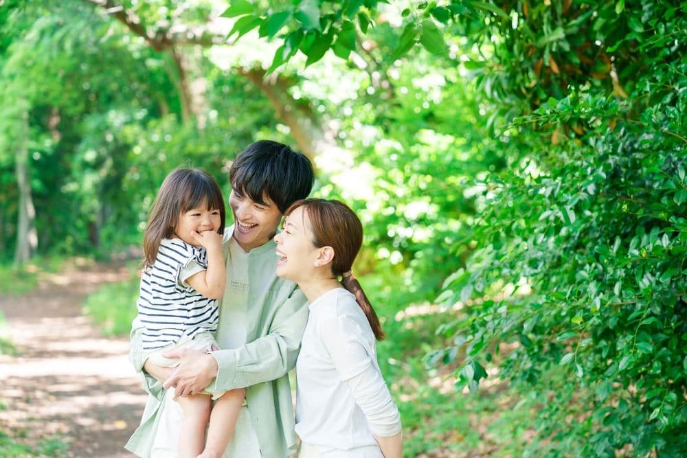 Young families enjoying the outdoors by walking in nature