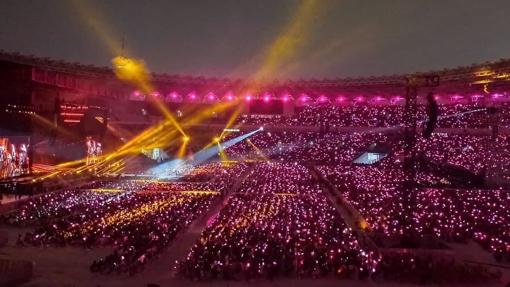 Girl group Blackpink kpop concert in the big stadium full of fans with lightstick